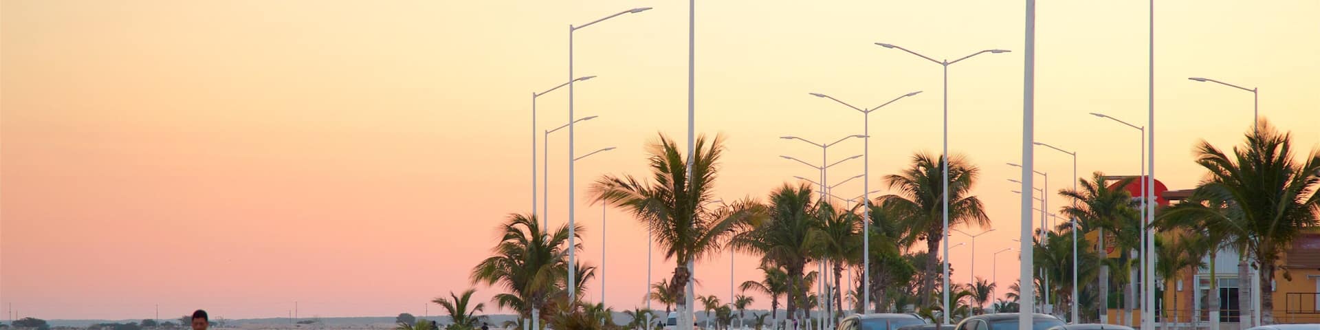 Campeche Waterfront Promenade showing a park, a bay or harbour and a sunset