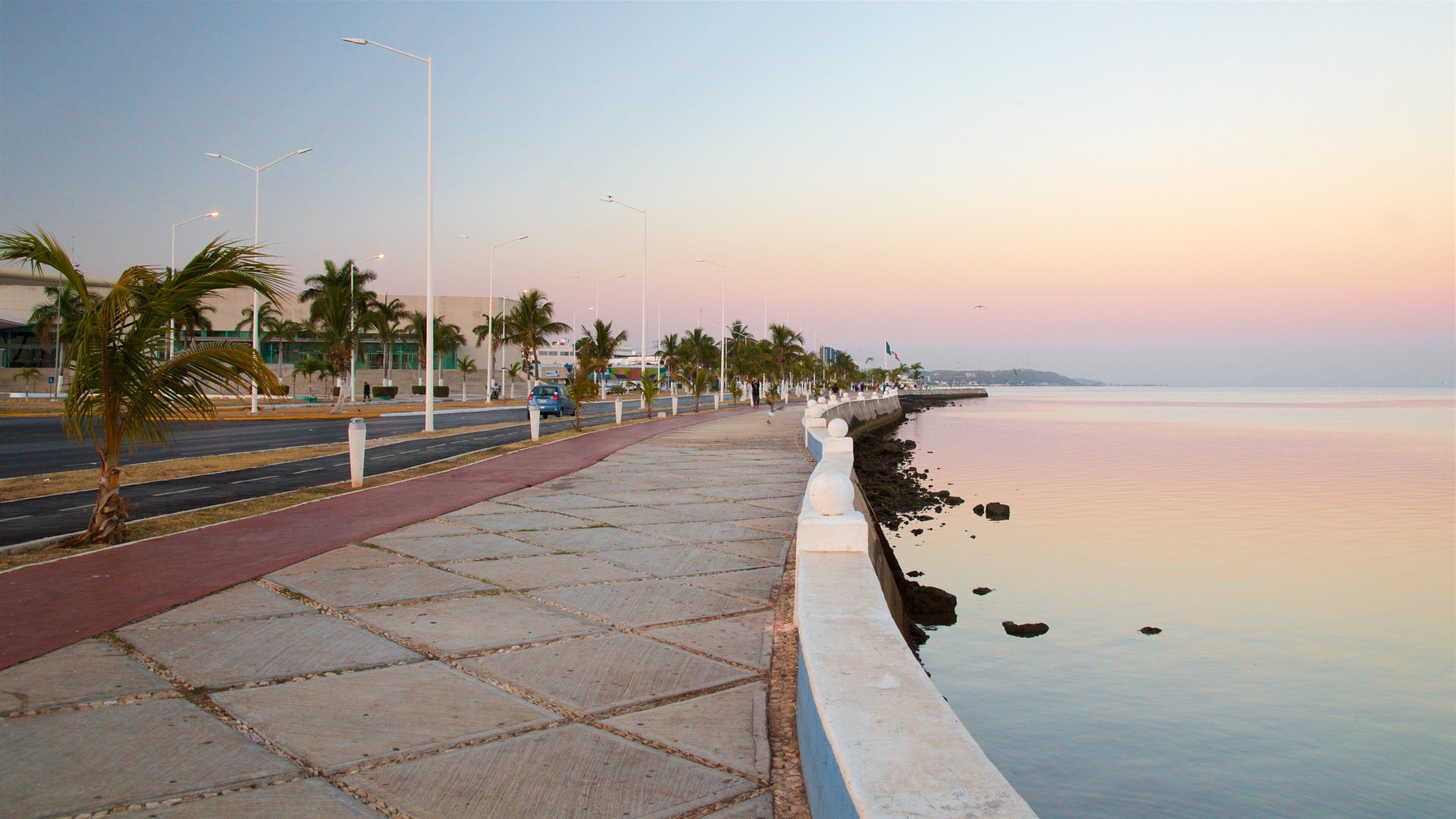 Campeche Waterfront Promenade showing a sunset and general coastal views