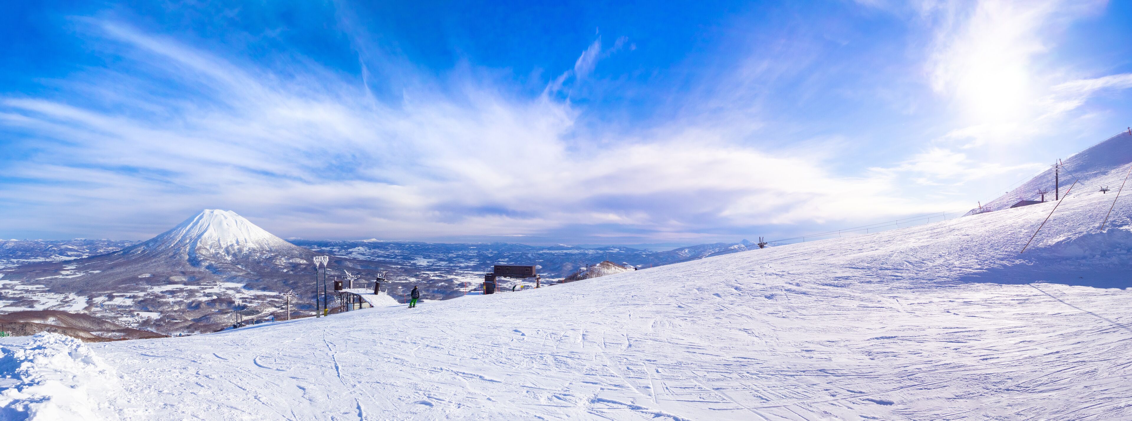 Slope with a view of snowy volcano (Niseko, Hokkaido, Japan)