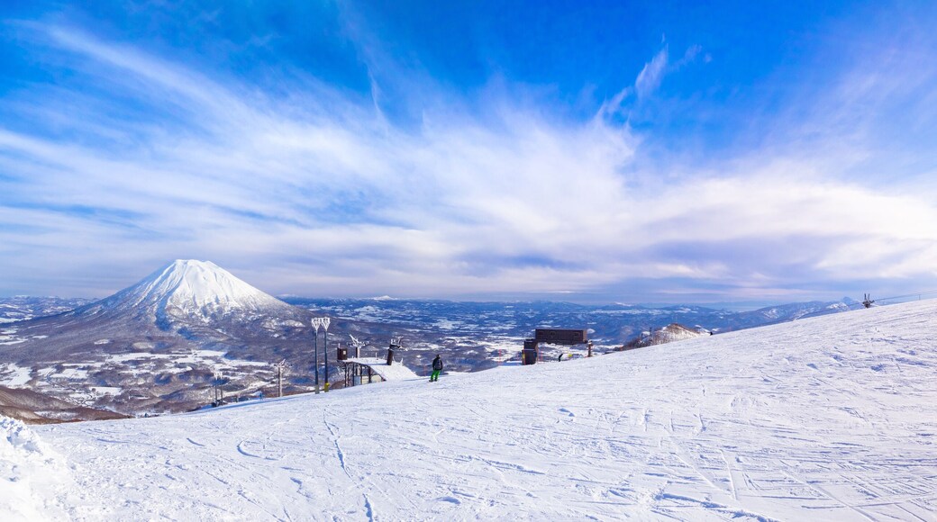 Slope with a view of snowy volcano (Niseko, Hokkaido, Japan)