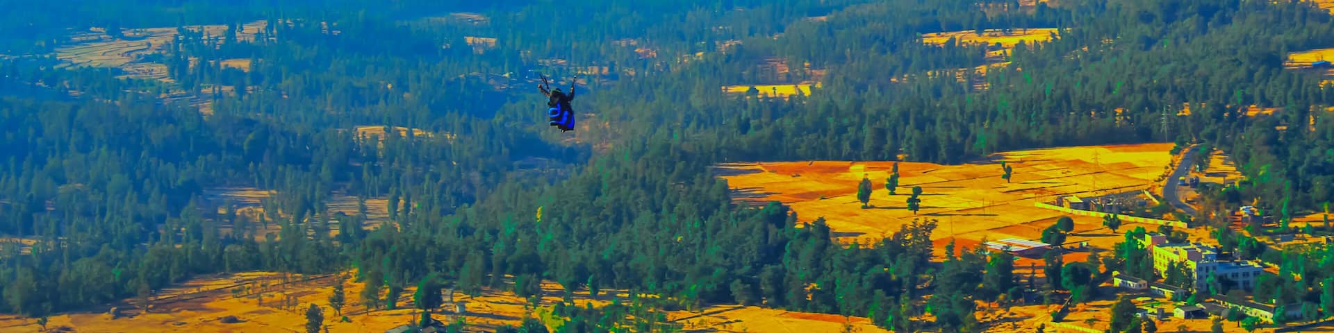 Summer mountain valley paragliding scene,Paragliding pilots focus on sky flight in saputara india,ountain valley paragliding,paragliding on the mountains