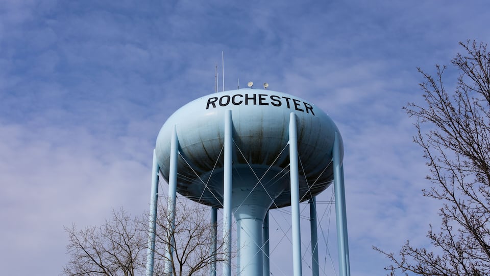 A water tower labeled "ROCHESTER" against a blue sky.