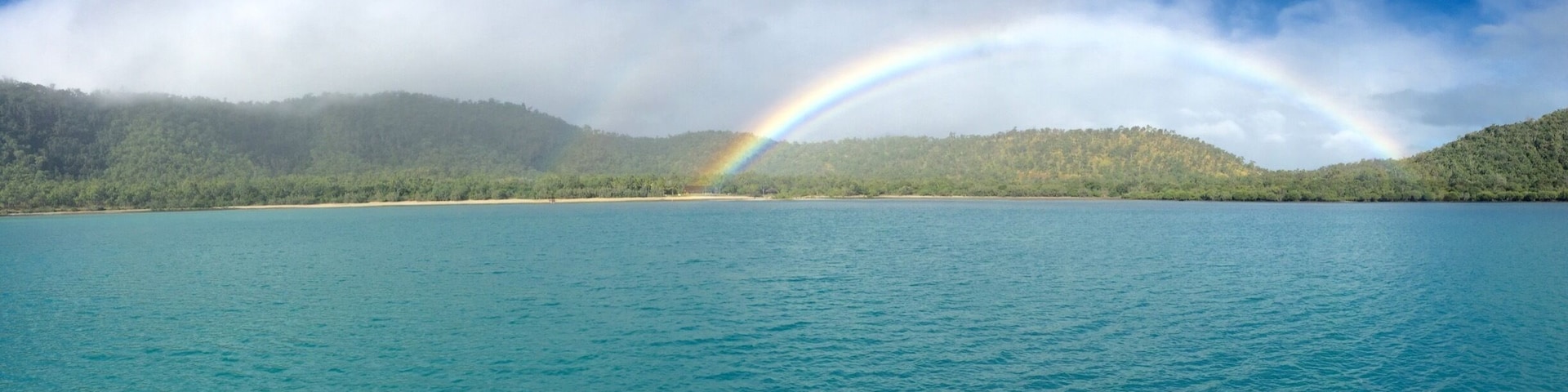 When the most perfect rainbow appears at the Whitsunday Islands in Australia. #AboveItAll
