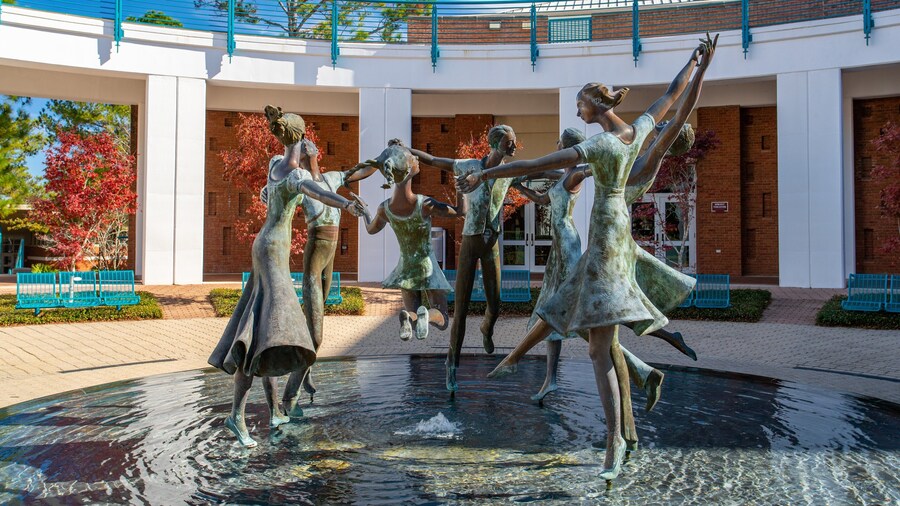 Fort Walton Beach - Destin featuring a statue or sculpture and a fountain