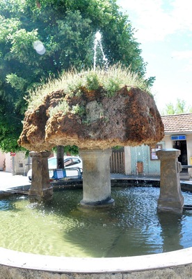 Apparently this fountain has been affected by the high calcium content of the local water, which has built up over the years to hide the original fountain itself.