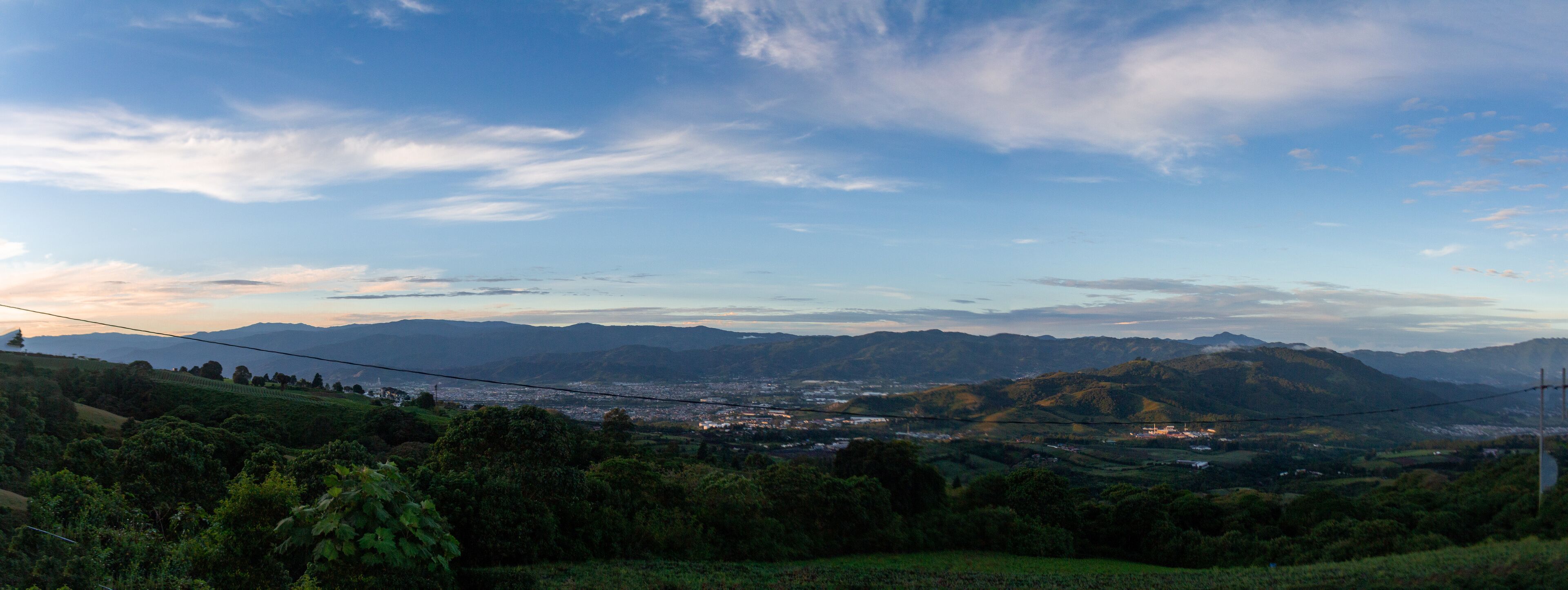 A mountainous landscape with a town nestled in the valley.