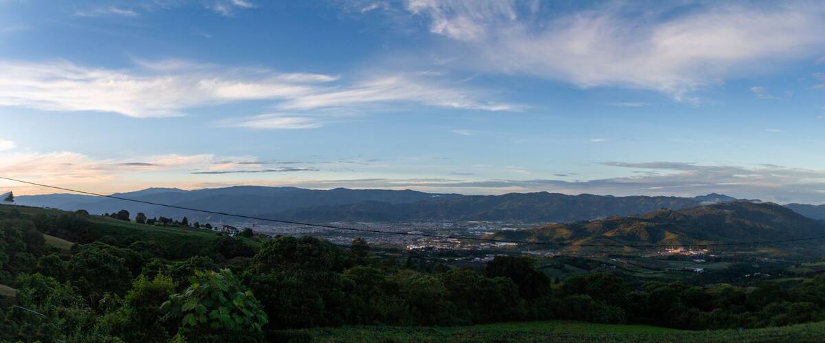 A mountainous landscape with a town nestled in the valley.