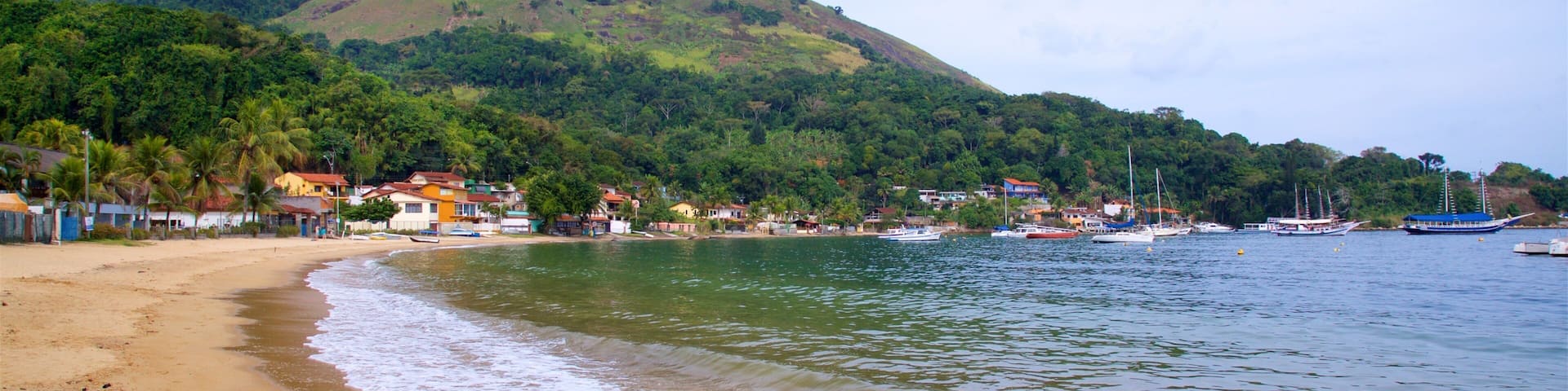 Biscaia Beach which includes a sandy beach, a coastal town and general coastal views