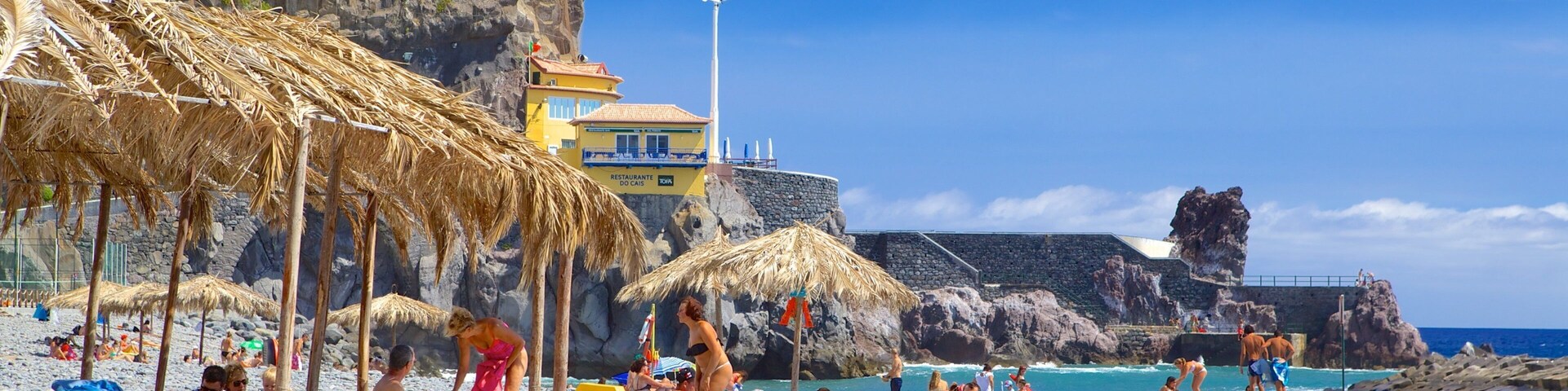 Ponta Do Sol Beach showing a pebble beach, general coastal views and swimming