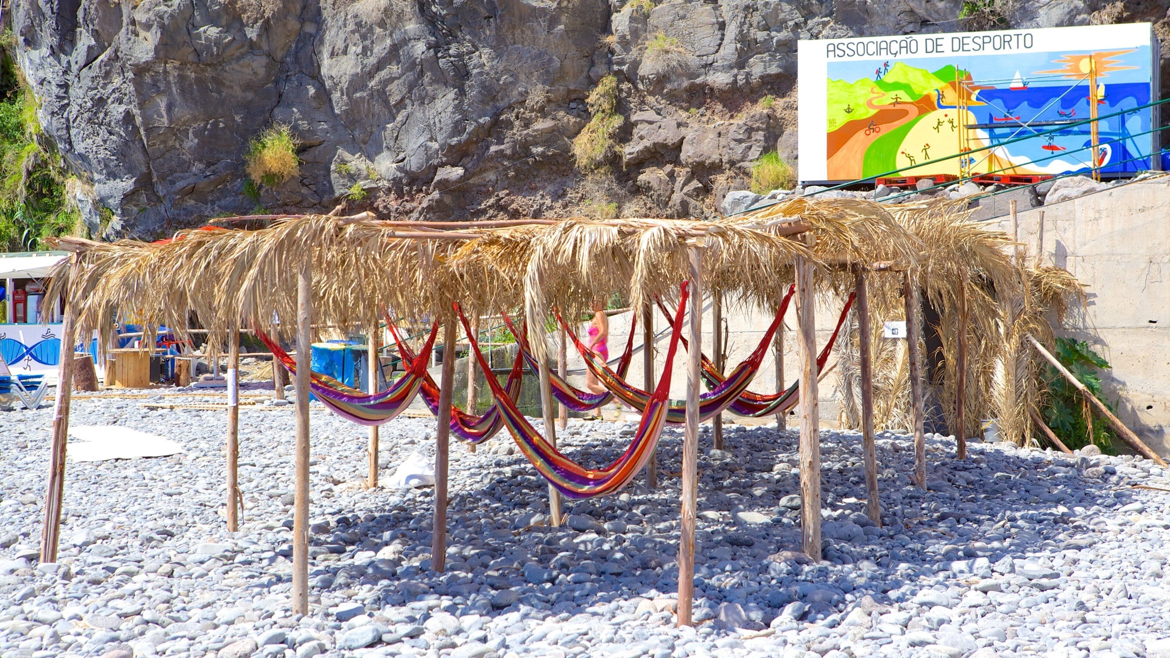 Ponta Do Sol Beach featuring a pebble beach