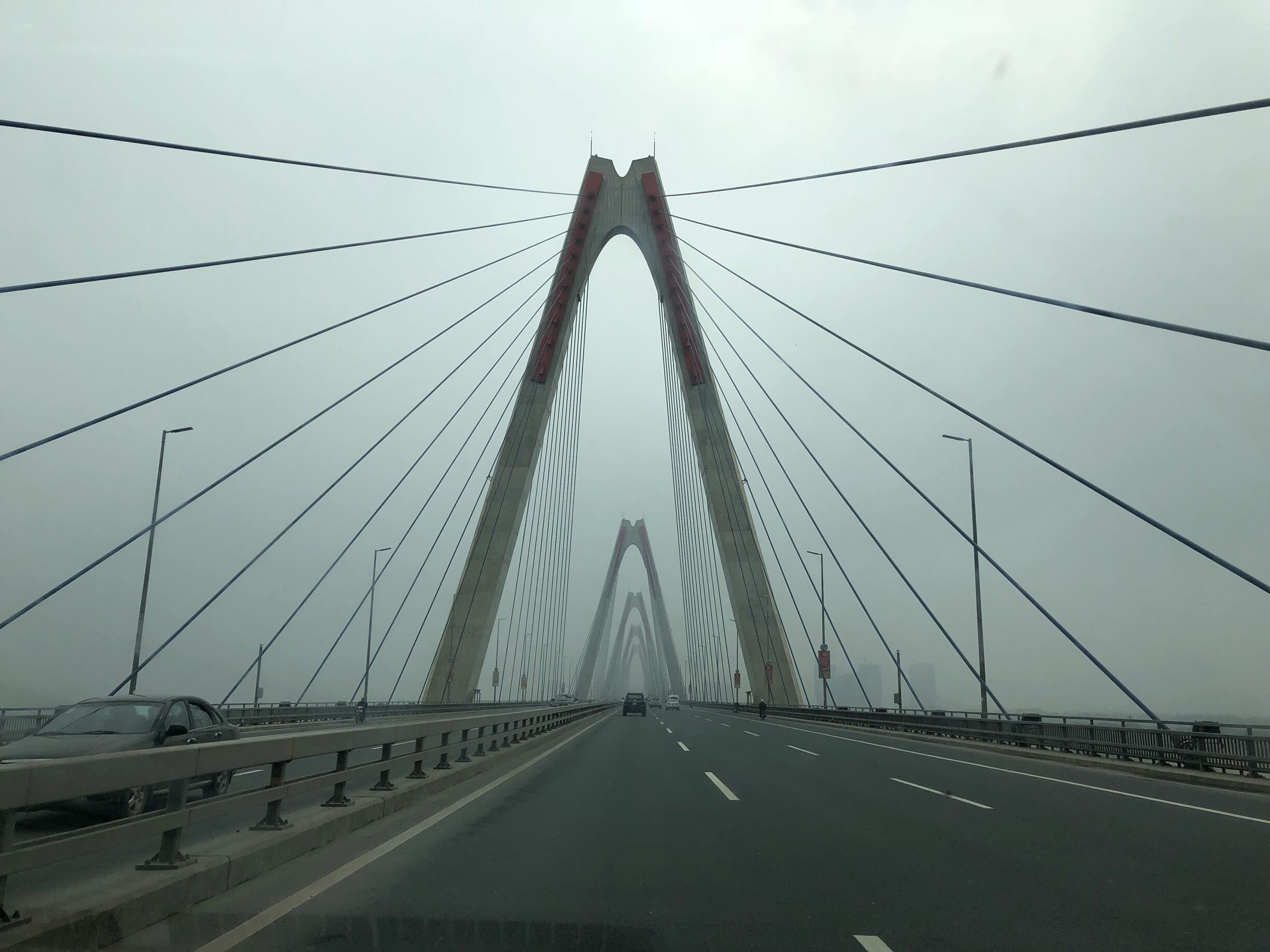 Into the spiders web. A misty welcome to Hanoi. 