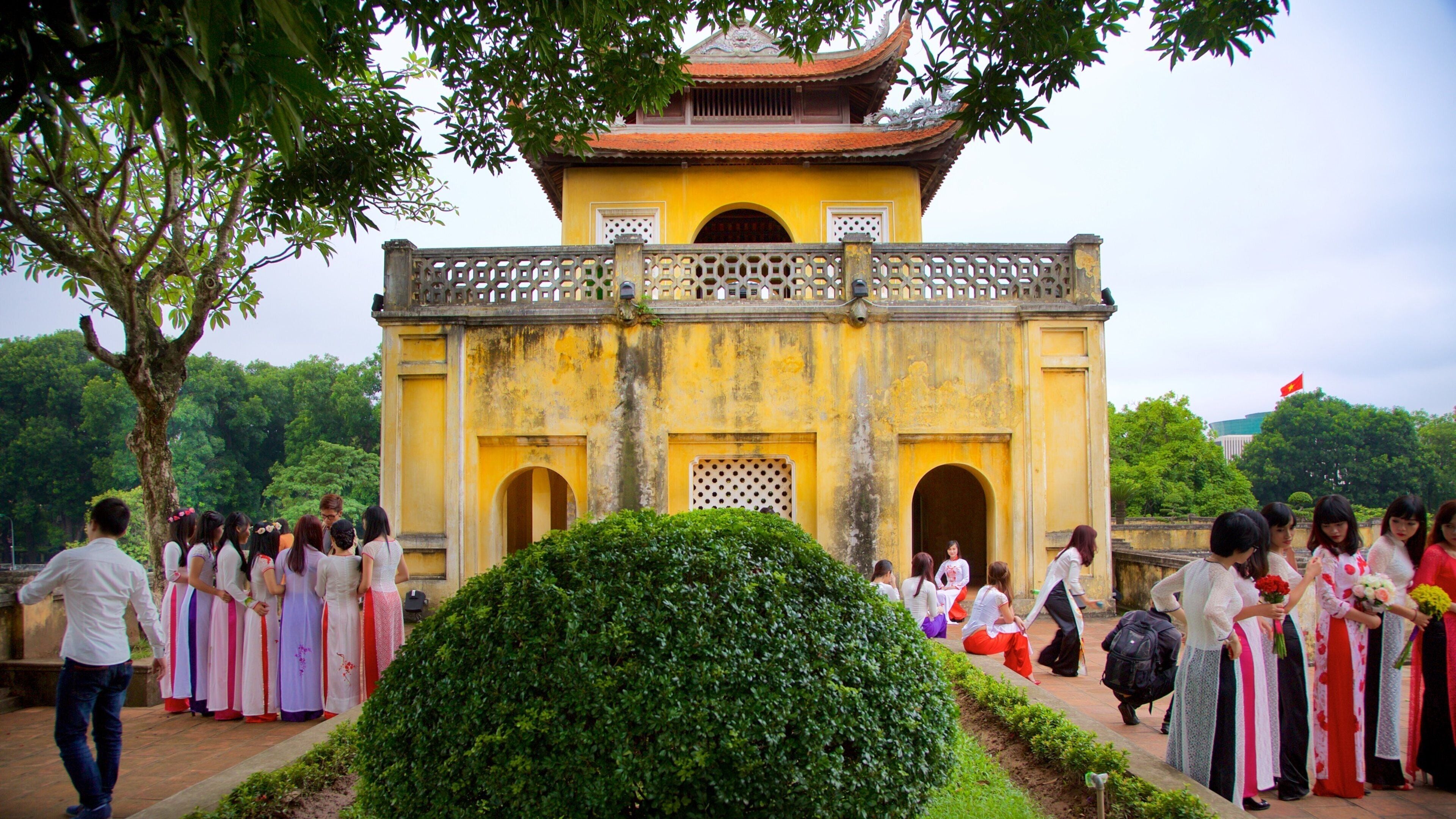 Hanoi Citadel which includes a temple or place of worship as well as a small group of people