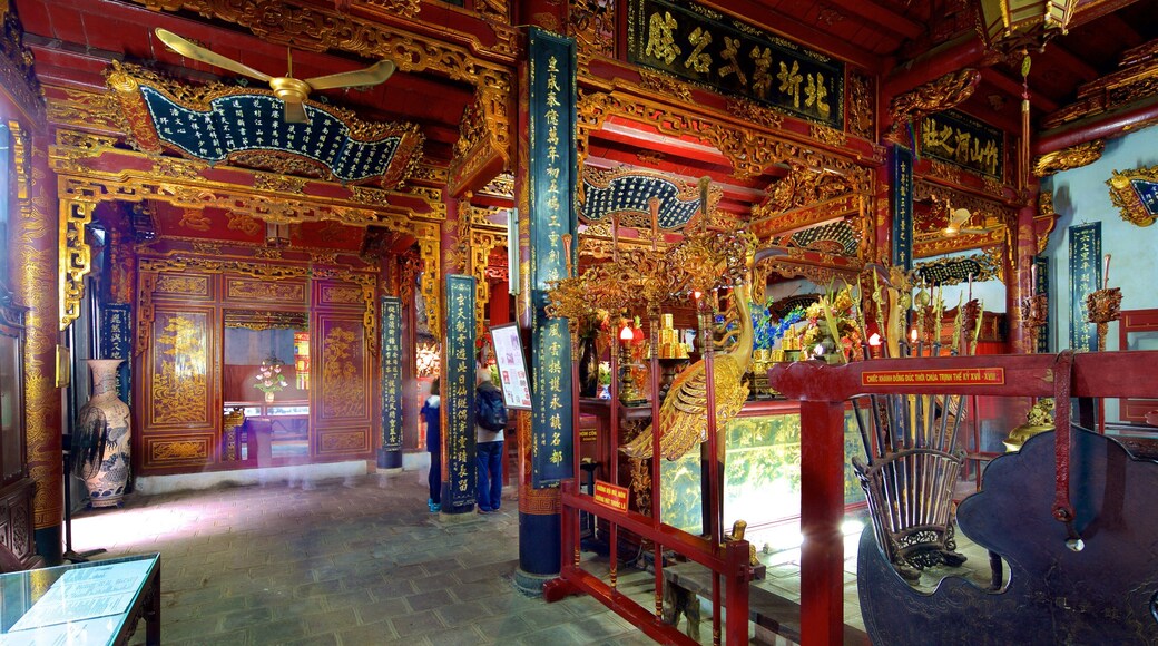Quan Thanh Temple which includes a temple or place of worship, religious elements and interior views