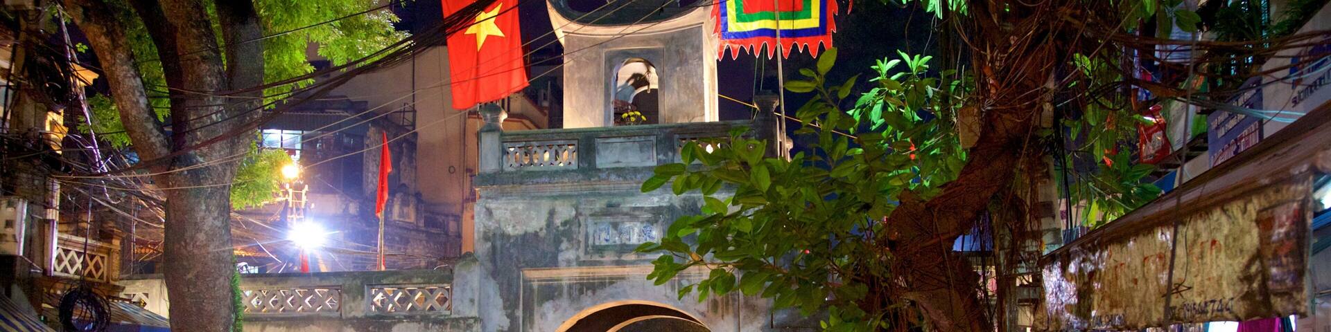 Hanoi Old City Gate which includes night scenes, a city and street scenes