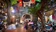 Hanoi Old City Gate which includes night scenes, a city and street scenes