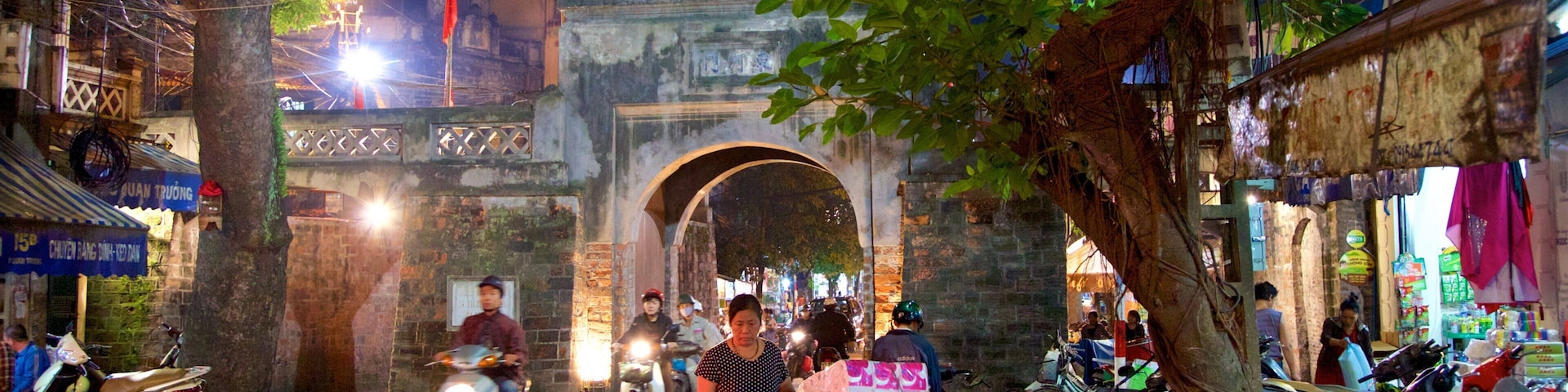 Hanoi Old City Gate which includes night scenes, a city and street scenes