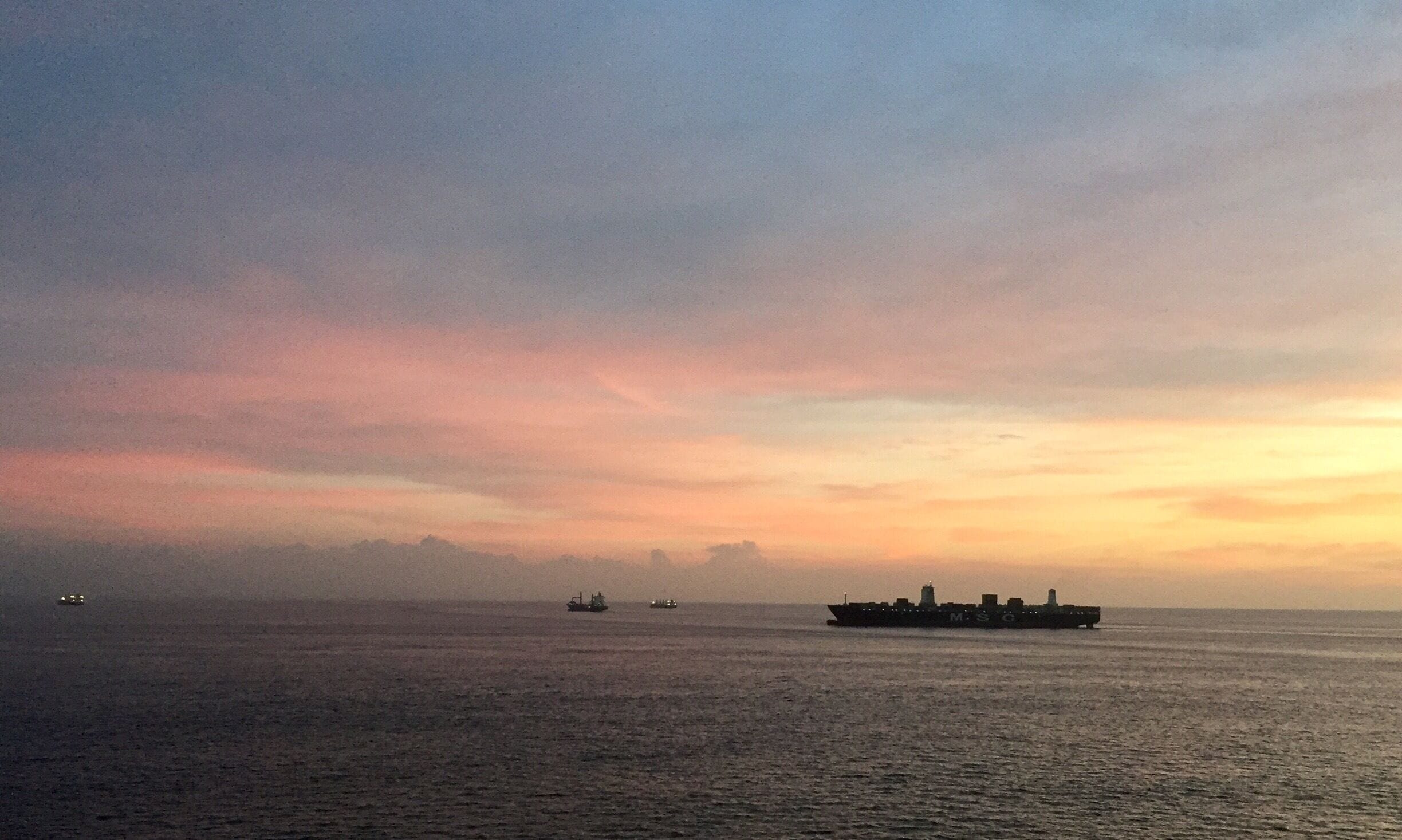 Sunrise outside Panama City, Panama prior to entering the Miraflores locks on the Pacific Ocean side of the Panama Canal. 