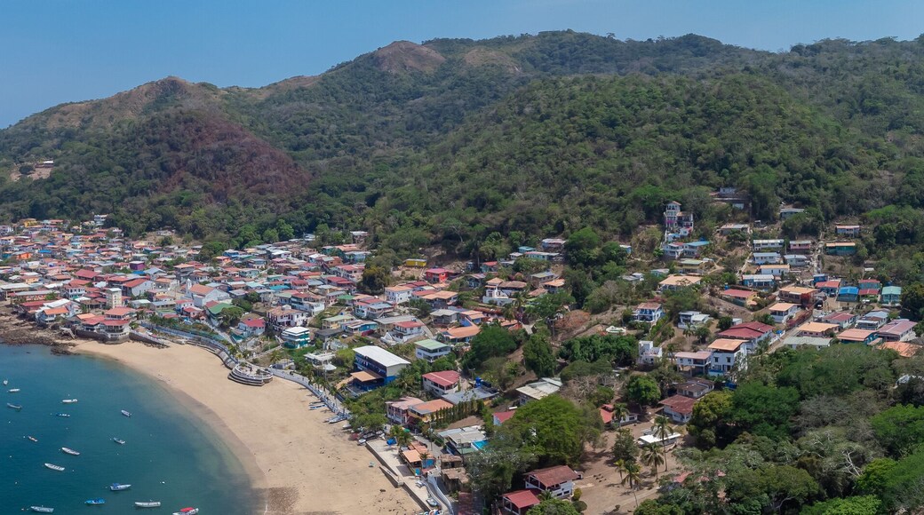 Aerial drone panorama of the village and island of Taboga, popular getaway spot close to Panama city. Visible village, houses and hills in the background.