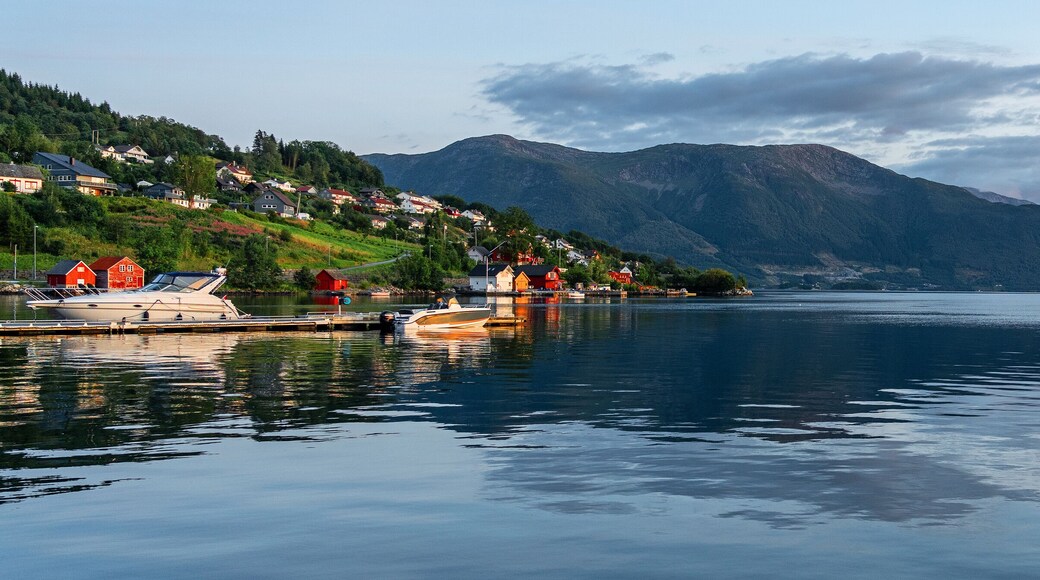 Norwegian fjords rural landscape, Norway, mountain sea view, Rosendal village houses on green hill.