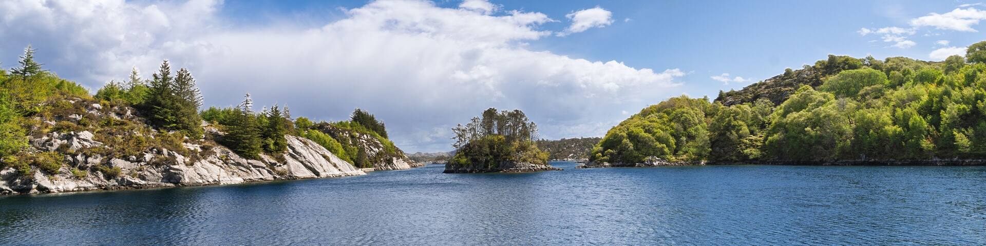 Crystal Clear Inlet Surrounded by Rocky Cliffs and Dotted with Greenery, Bomlo, Norway