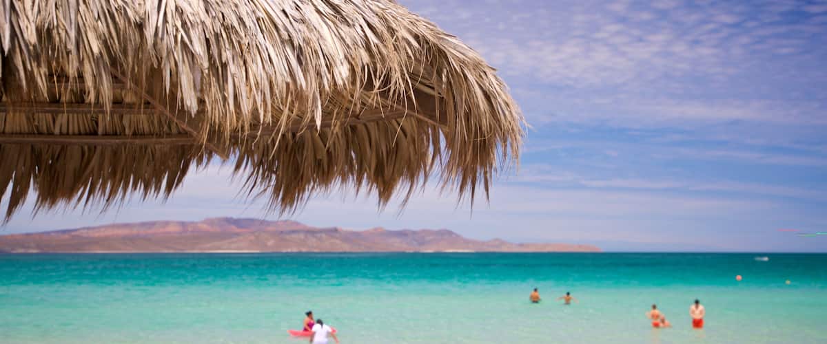 El Tecolote Beach showing tropical scenes, general coastal views and a sandy beach