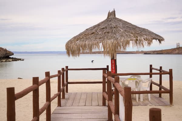 Tesoro Beach showing general coastal views, tropical scenes and a beach