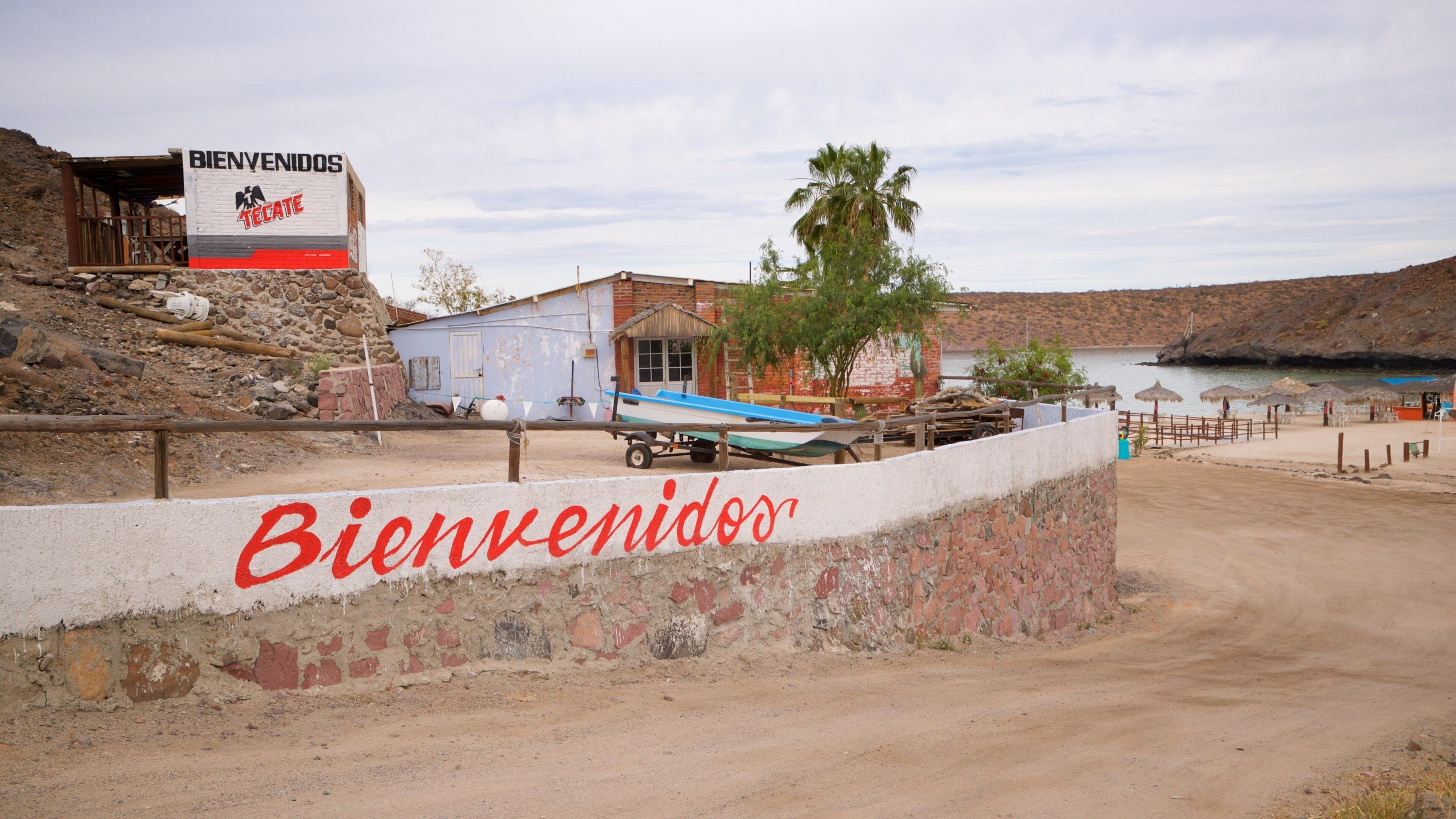 Tesoro Beach featuring a small town or village and signage