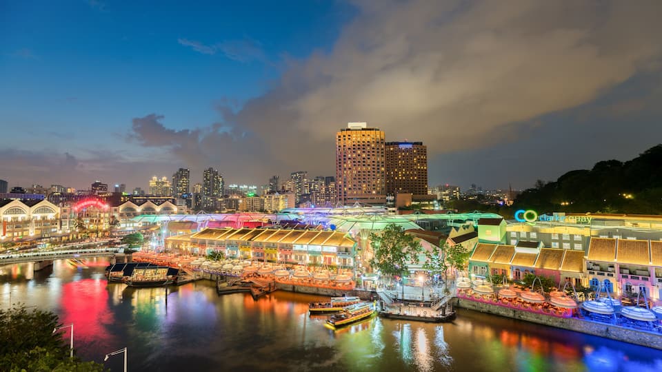 Colorful light building at night in Clarke Quay, Singapore. Clarke Quay, is a historical riverside quay in Singapore.