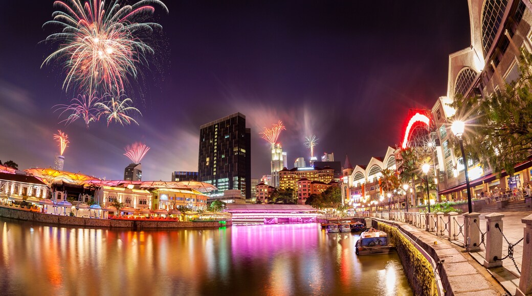 Fireworks set off in the backdrop to the Singapore River along Clarke Quay as a precursor to Singapore's 50 years of independence celebration., Shutterstock ID 329680286, Purchase Order: -