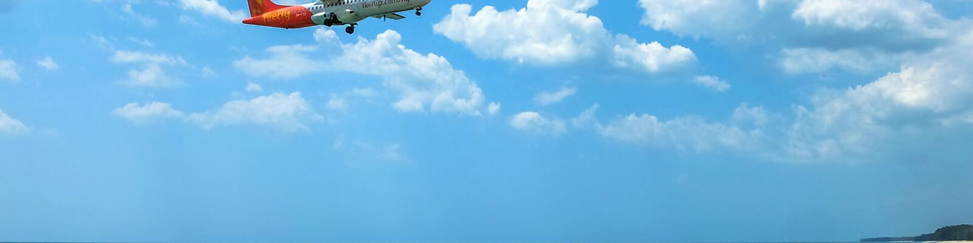 Phuket International Airport runway starts/ends right on Mai Khao beachfront. It offers a very popular photo opp spot. Planes pass right above one's head when landing. This spot is so popular that several snacks and drinks stalls settle everyday under the shade of the trees right next to it. #LifeAtExpedia