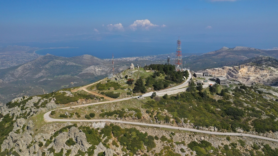 Aerial drone photo of top of Penteli mountain with great view to Athens urban area and Evian Gulf, Attica, Greece