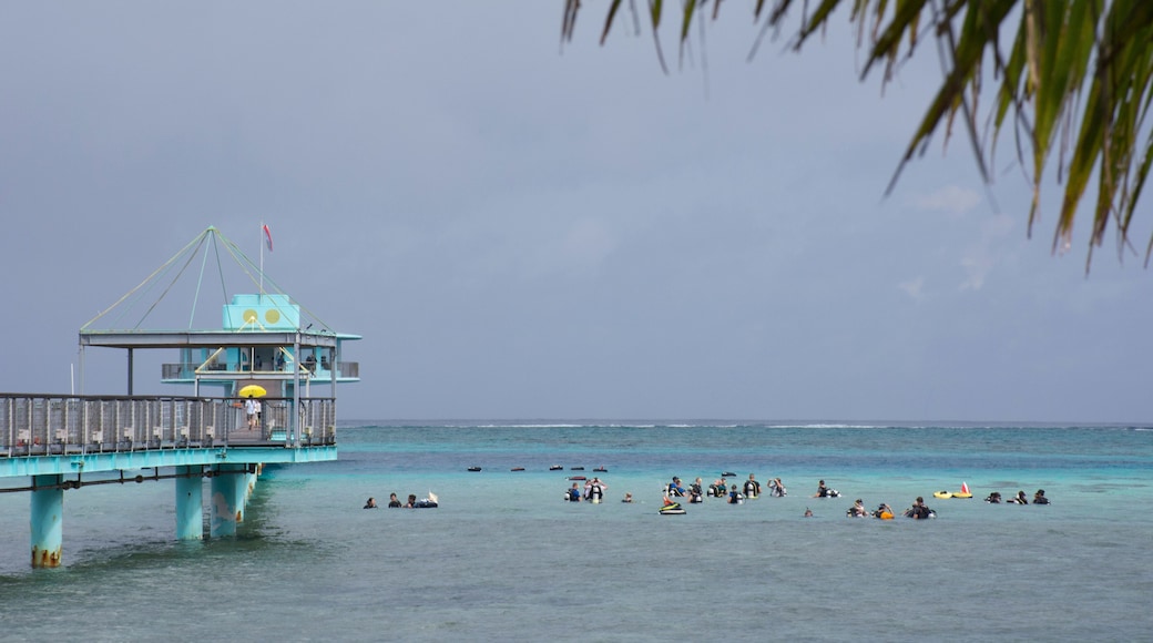 Micronesia, Mariana Islands, US Territory of Guam. Fish Eye Marine Park located on the Philippine Sea. Long pier with scuba diving students.