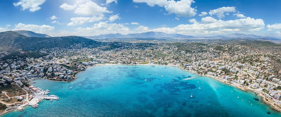 Wide panoramic aerial view of the town and bay of Porto Rafti, popular destination for Athenians during summer time, Attica, Greece