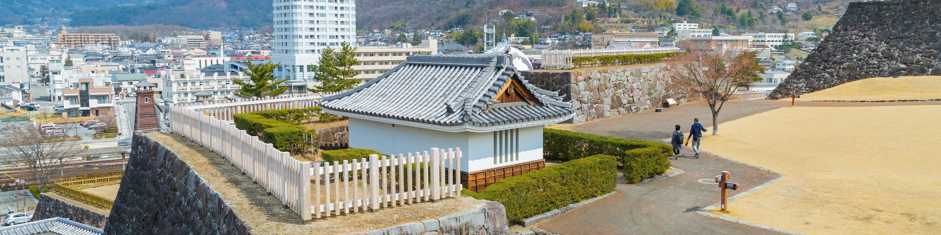 Maizuru Castle featuring landscape views and a city as well as a couple