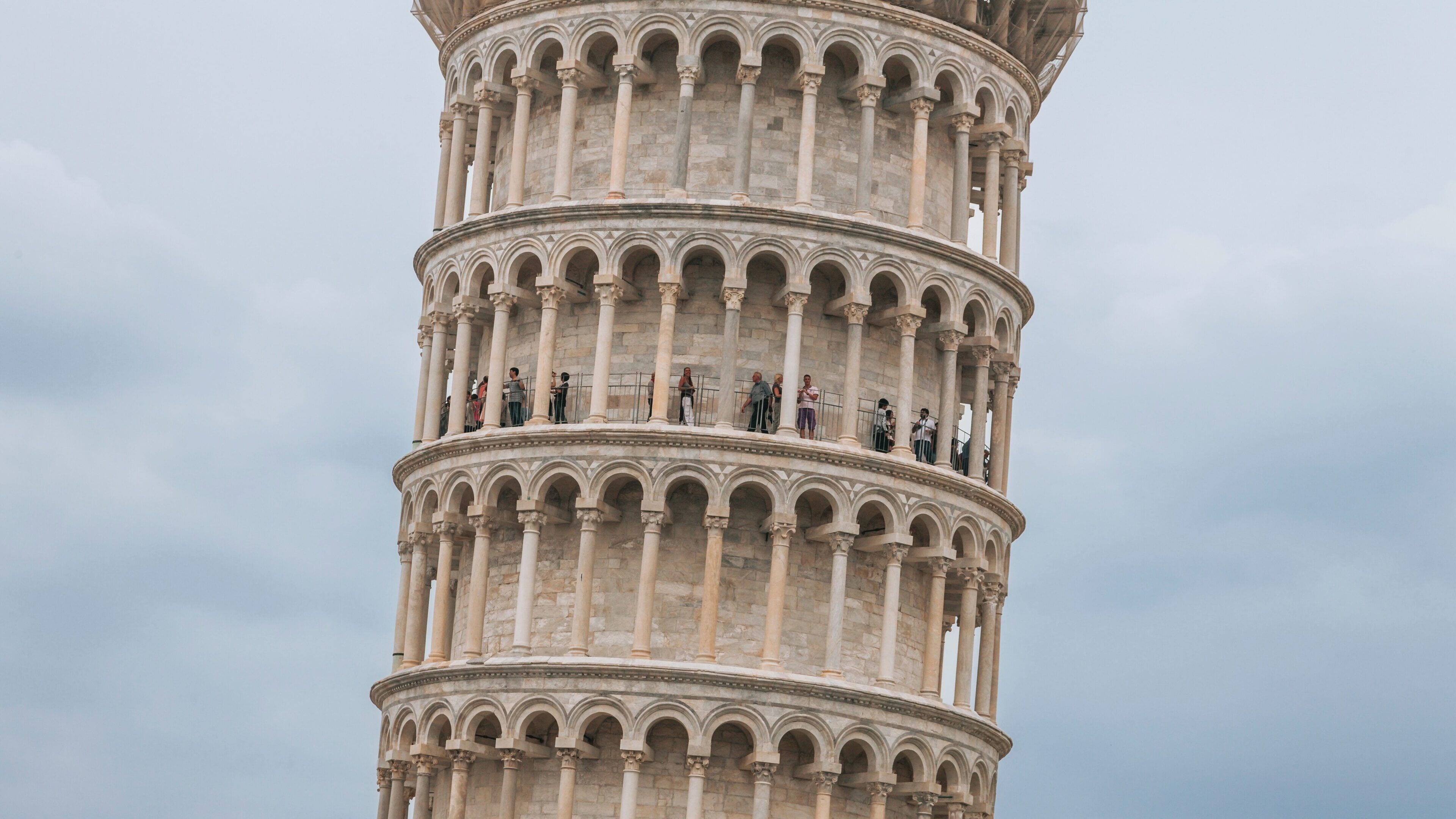 Leaning Tower showcases its iconic tilt in Pisa City Centre, an architectural marvel in Tuscany, Italy attracting numerous visitors daily
