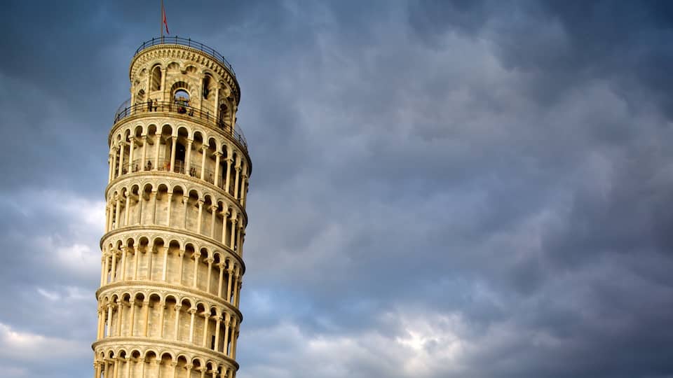 The Leaning Tower of Pisa with a cloudy sky in the background.