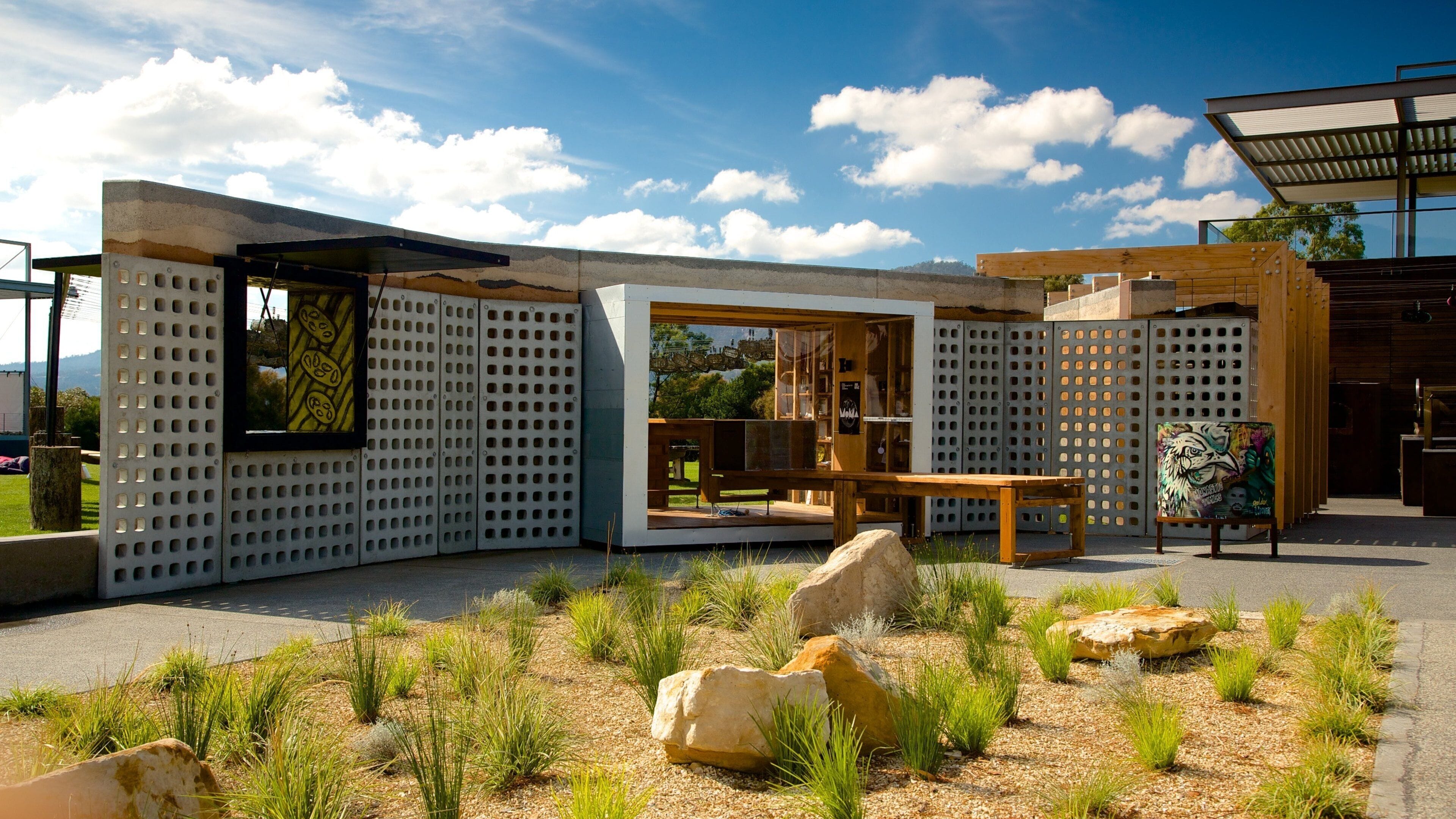 Museum of Old and New Art showing outdoor art, modern architecture and a garden