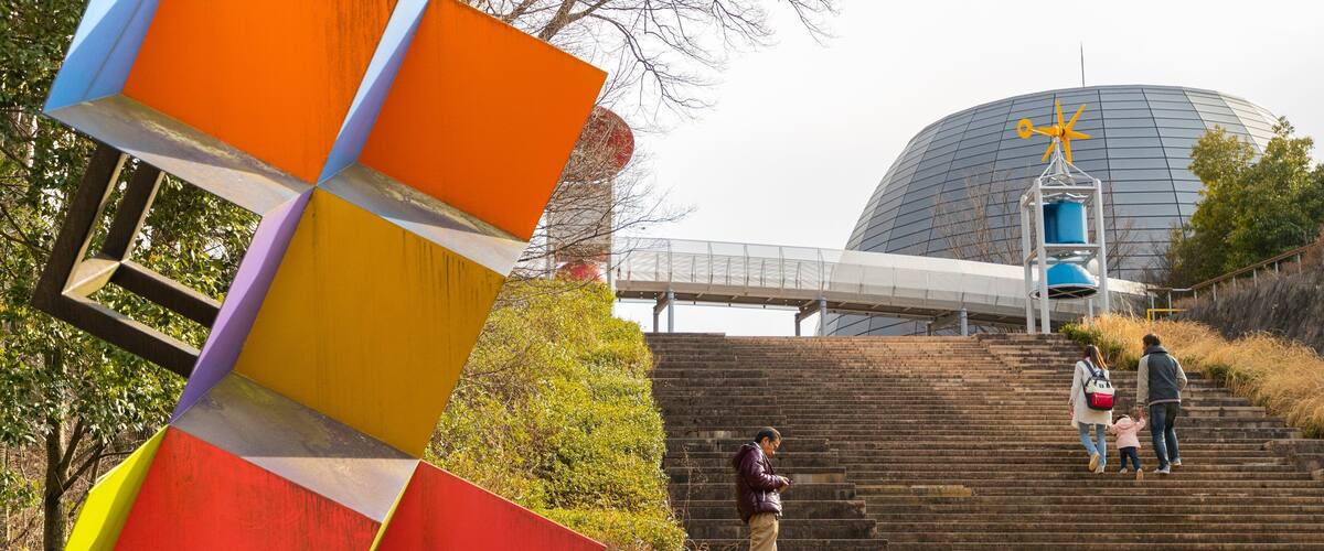 Yamanashi Science Center featuring outdoor art as well as a family