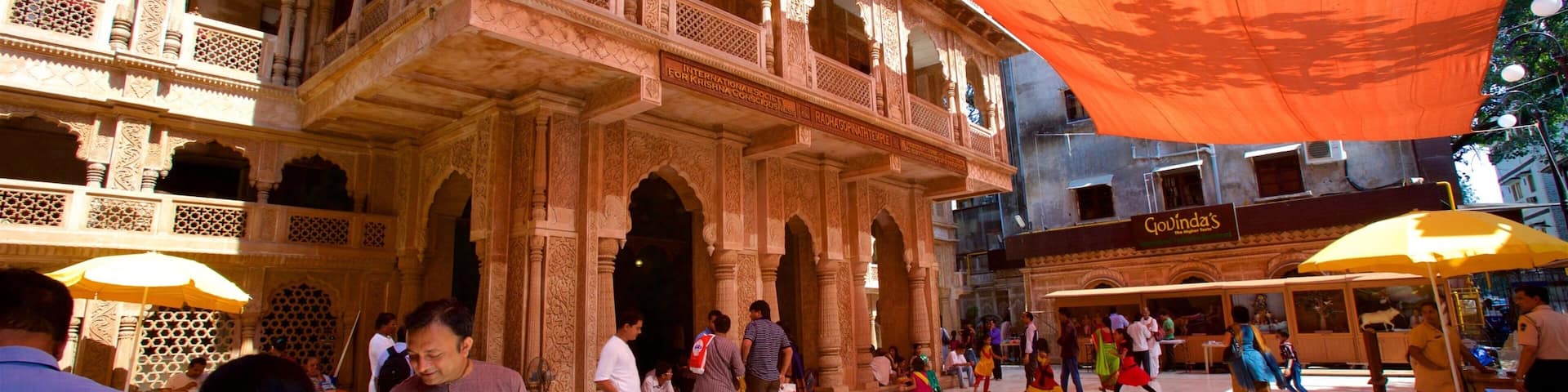 ISKCON Temple which includes a temple or place of worship as well as a small group of people