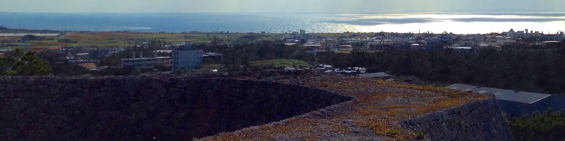 These castle ruins give a great vantage point over looking Yomitan. There is a small park of paths and pine trees around the base and beautiful grass to sit and relax inside.