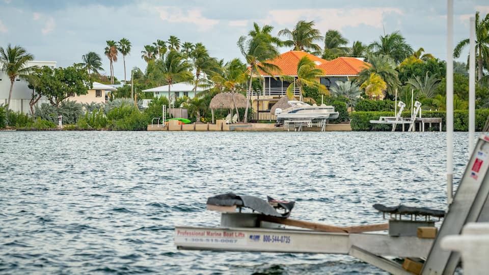 Sugarloaf Shores which includes a bay or harbor and a house