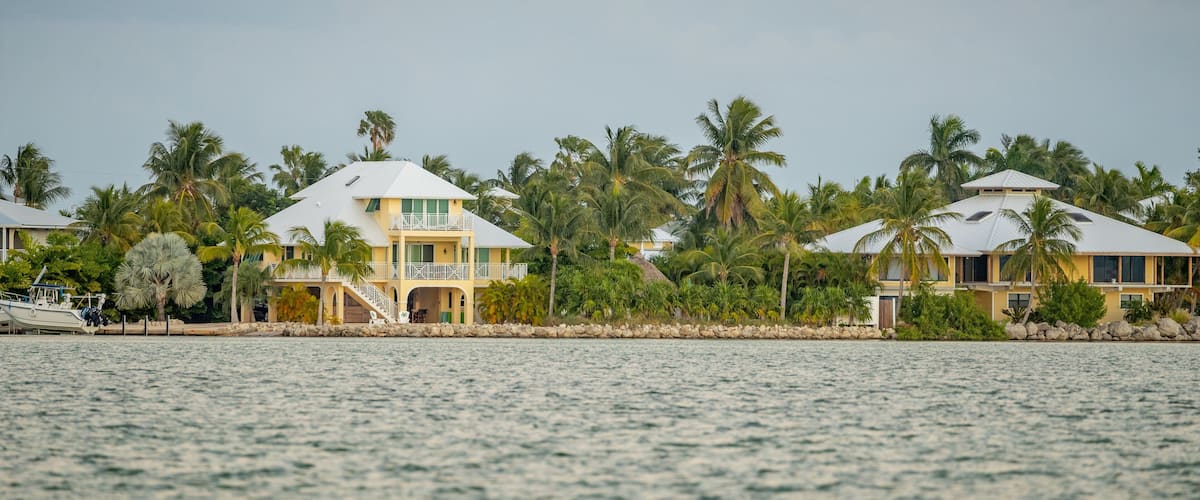 Sugarloaf Shores which includes a bay or harbor and a house