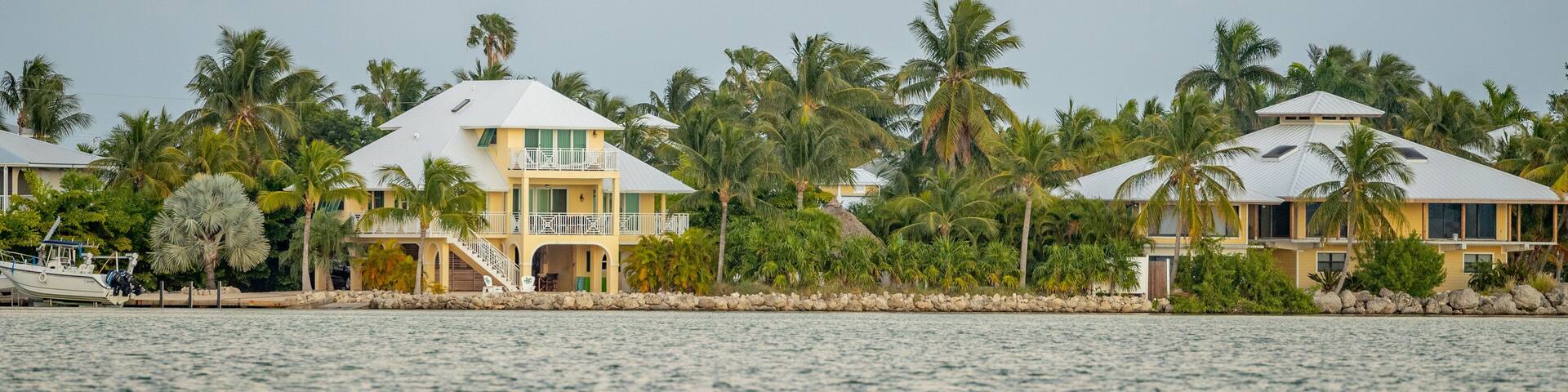 Sugarloaf Shores which includes a bay or harbor and a house