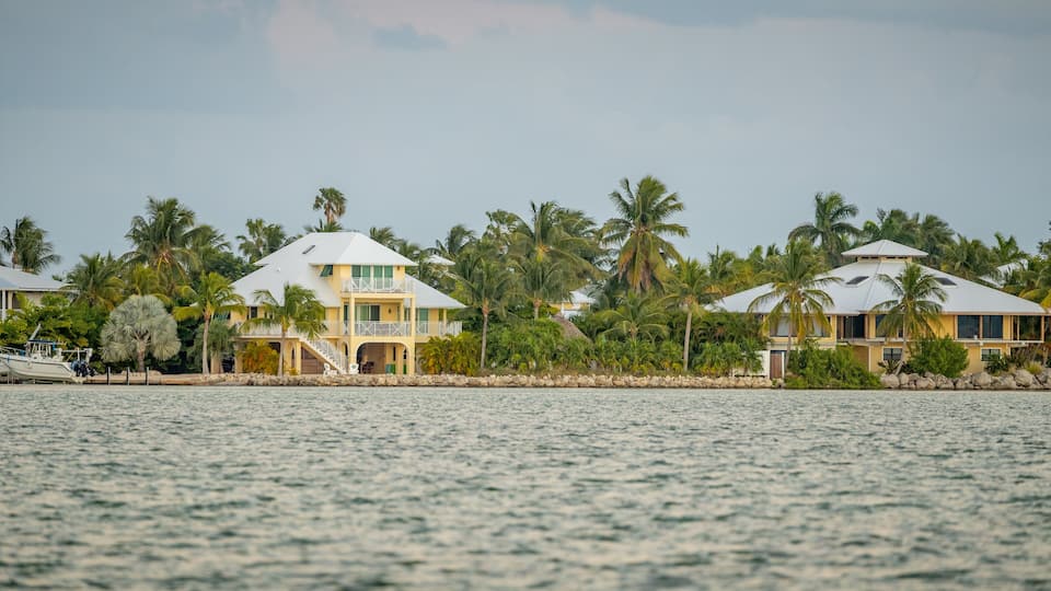 Sugarloaf Shores which includes a bay or harbor and a house
