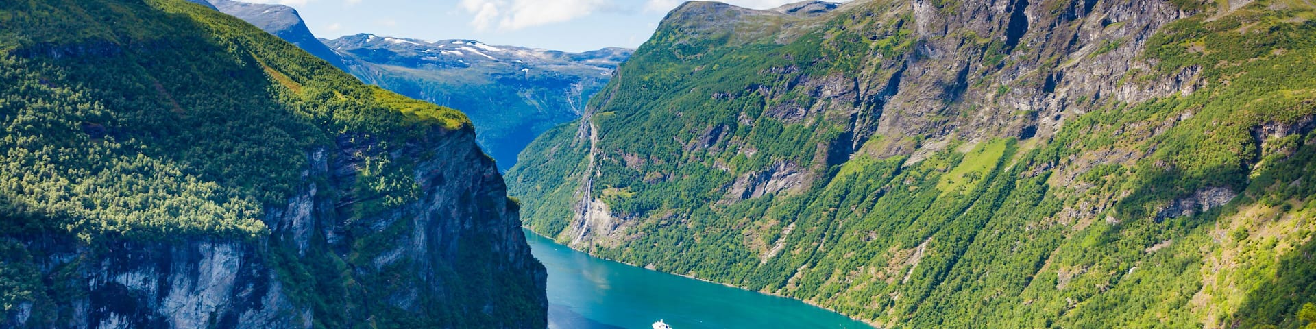 Fjord Geirangerfjord with boats, Norway.