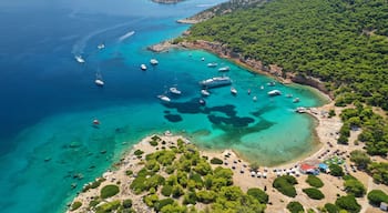 Aerial drone ultra wide photo of exotic bay of Moni island visited by yachts and sail boats, Aegina island, Saronic gulf, Greece