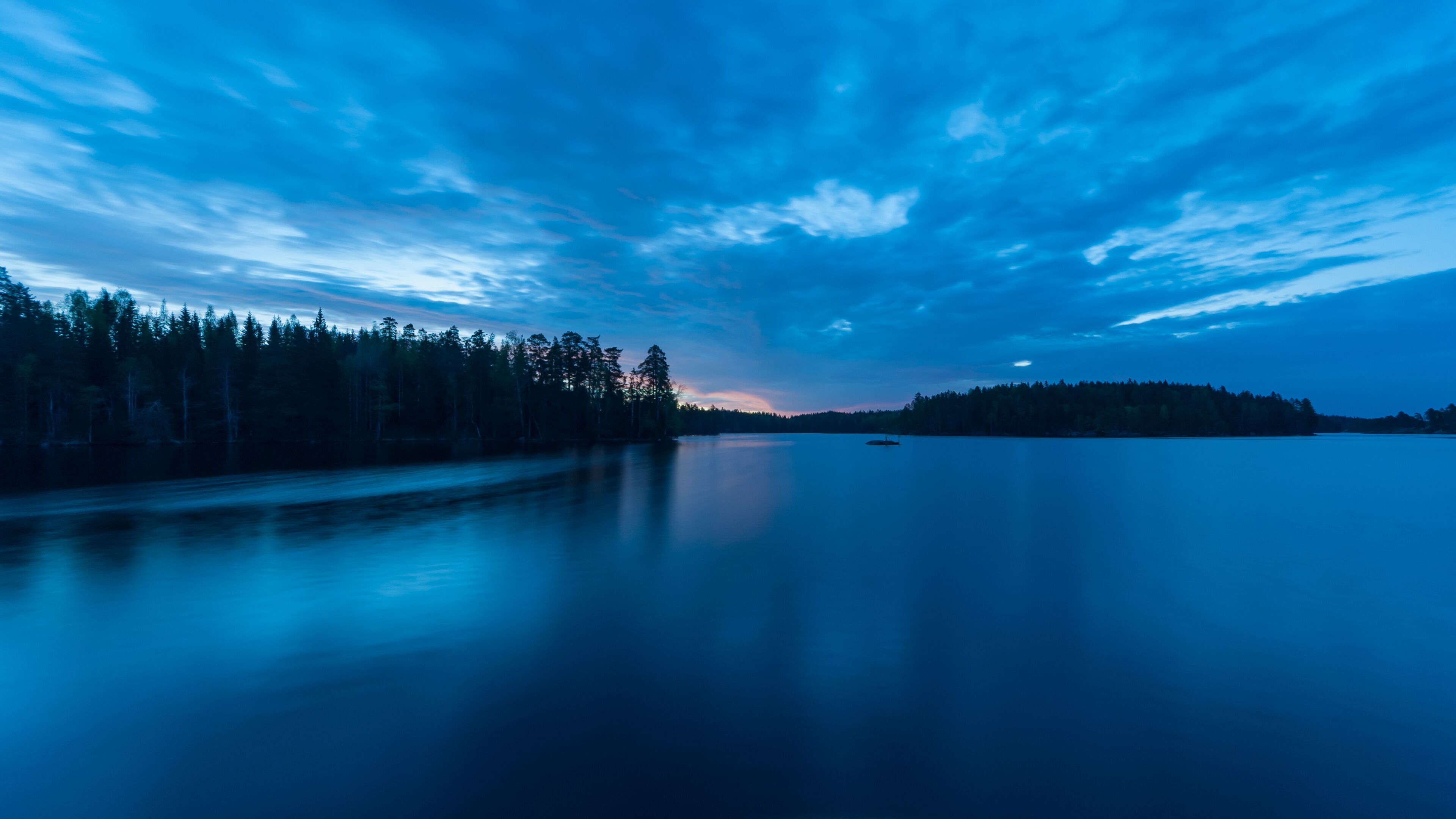 Early summer night by a lake in the forests of Finland