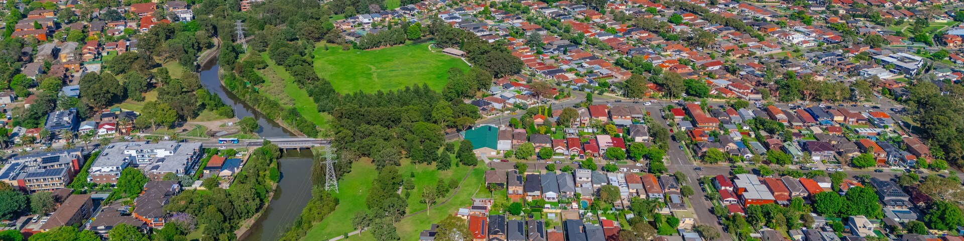 Panorama aerial drone view of western Sydney Suburbs of Canterbury Burwood Ashfield Marrickville Campsie with Houses roads and parks in Sydney New South Wales NSW Australia