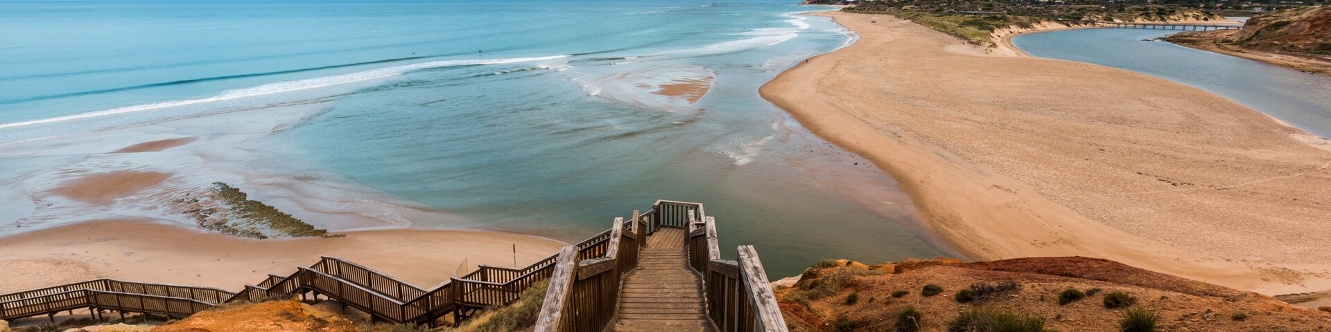 The wooden staircase leading down to the mouth of the Onkapringa river Port Noarlunga