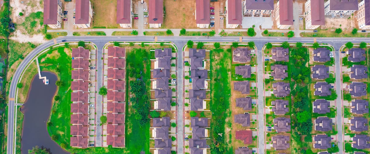 Aerial view of Lakowe Golf Estate with modern homes and a scenic lake surrounded by greenery, Lakowe, Nigeria.